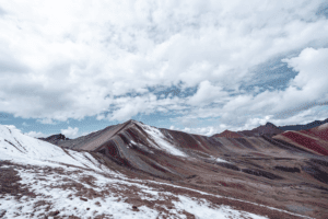 rainbow mountains covered in snow in the winter