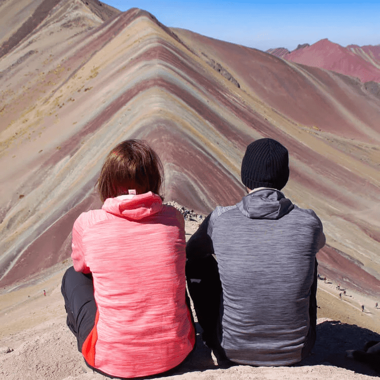 private tour A picture of people sitting near Rainbow Mountain