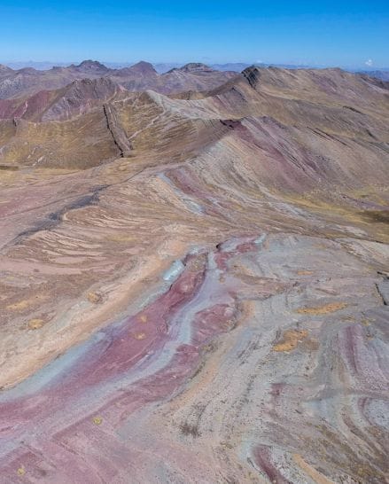 Aerial fly drone view of Rainbow Mountain