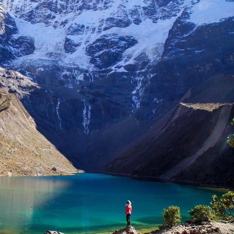 Lake a person standing near a lake