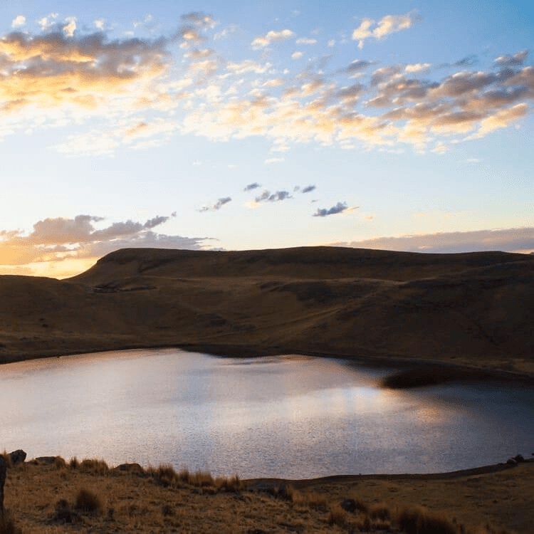 A lake in Peru with Andean mountains in the background.