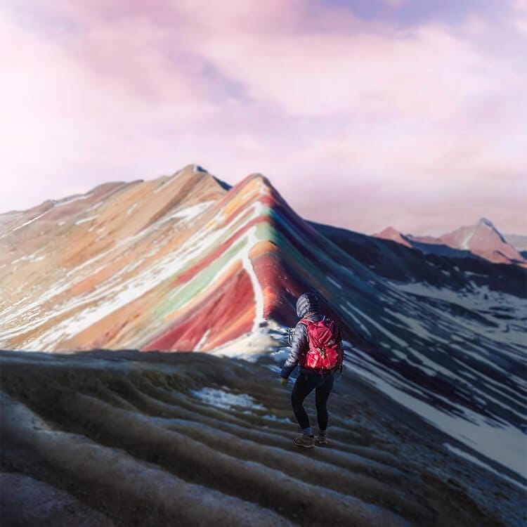 A person on a mountain during a Rainbow Mountain tour