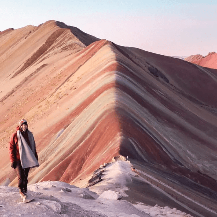  a tourist enjoying the Peruvian sunrise