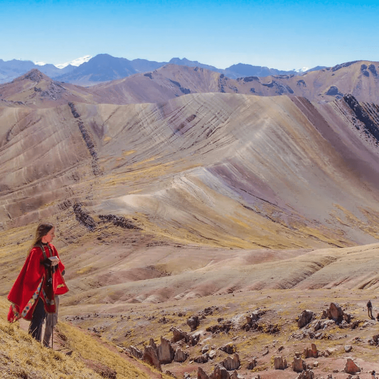 a woman staring at a mountain