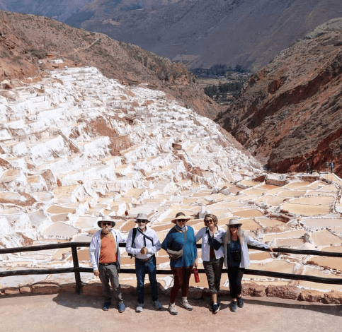 A distant view of Machu Picchu with a group of people
