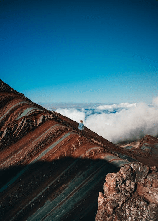 Hiker enjoying the view on Rainbow Mountain from Cusco