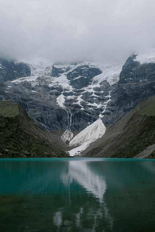 Snow-capped mountains reflecting on Humantay Lake