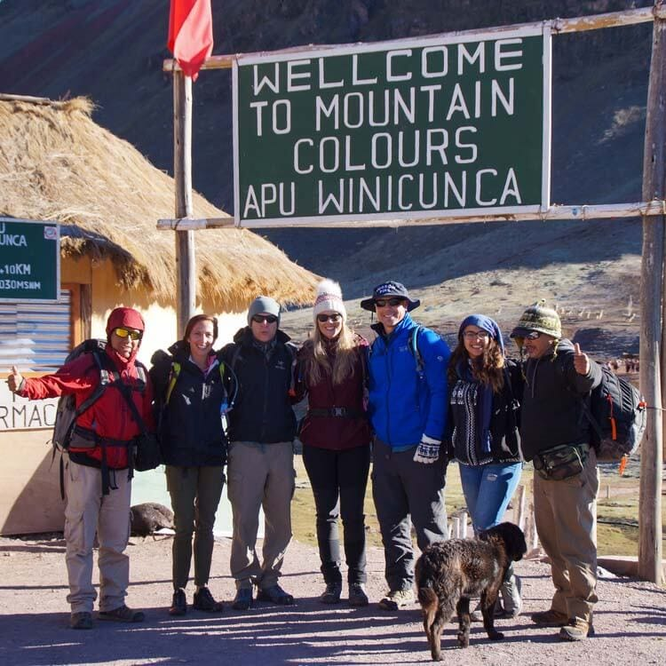 a group of people posing together after trekking