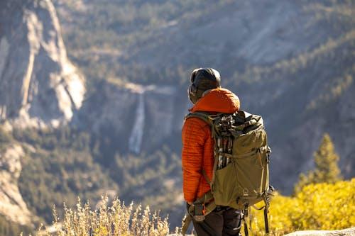 A person standing and looking at the scenic beauty in front of him