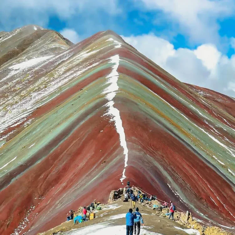 groups of people on tour at the Rainbow Mountain