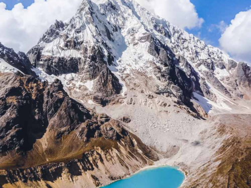 Aerial view of a vivid turquoise glacial lake.